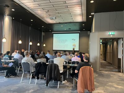 Full conference room with many people for the Amend Meeting